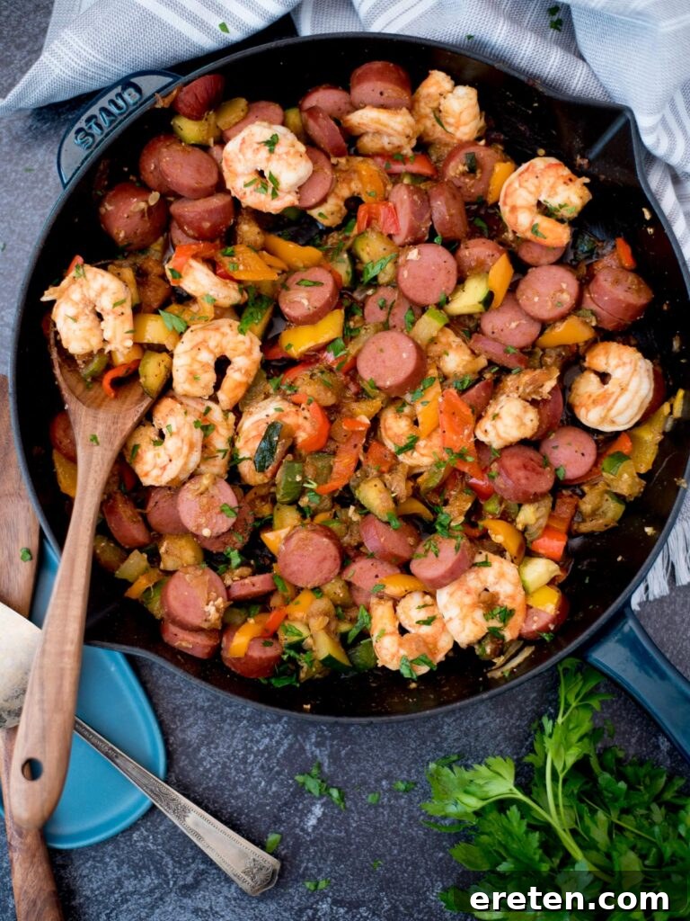 Cajun Fire Skillet with Shrimp and Sausage 2 Top view of a cast iron pan with cajun shrimp, sausage and vegetables