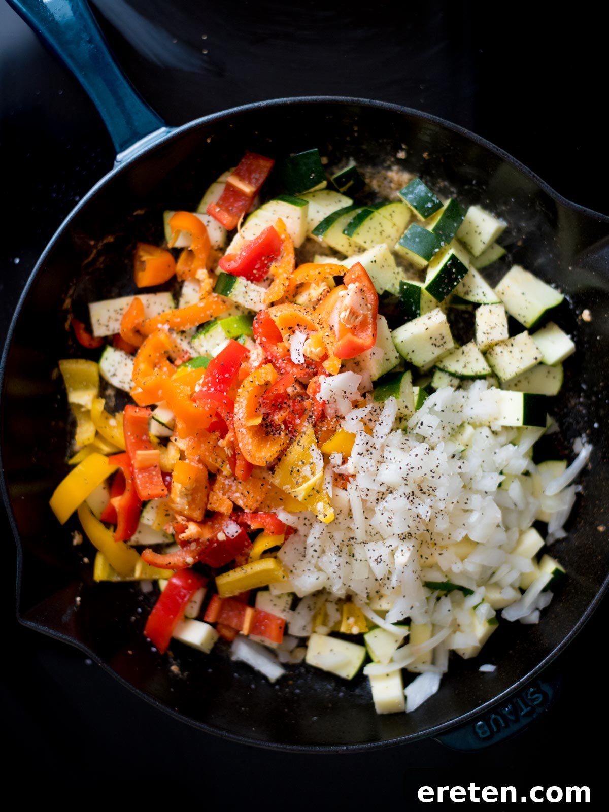 Cajun Fire Skillet with Shrimp and Sausage 5 Diced veggies and seasonings added to a cast iron skillet.