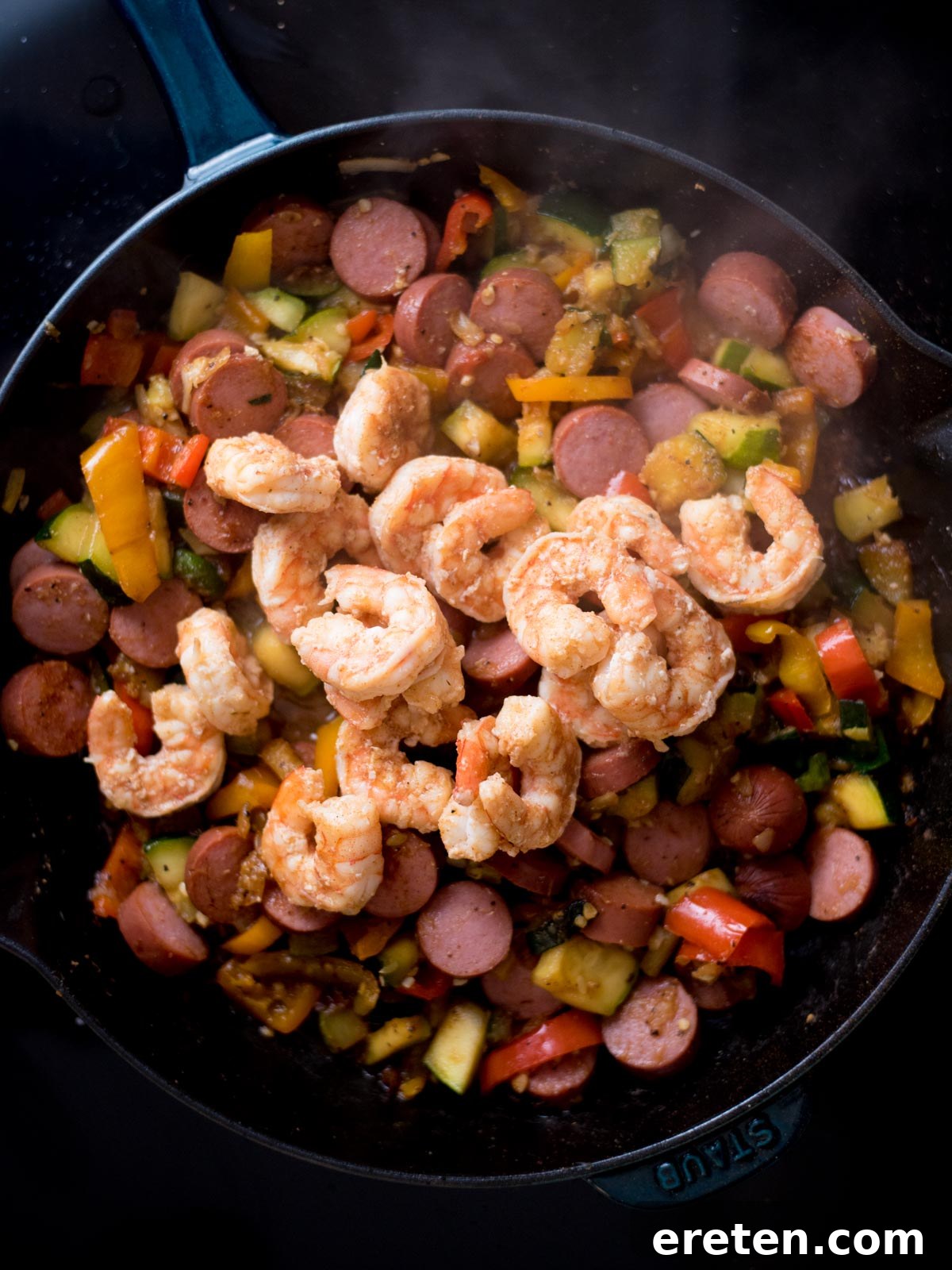 Cajun Fire Skillet with Shrimp and Sausage 8 Shrimp added to cooked sausage and veggies in a cast iron skillet.