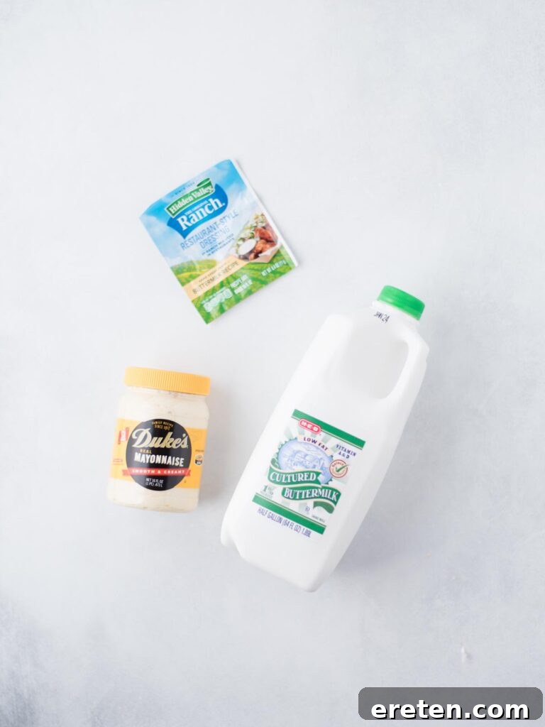 All three key ingredients: buttermilk, mayonnaise, and a packet of ranch mix, laid out on a kitchen counter, ready to be combined for Wing Stop Ranch.
