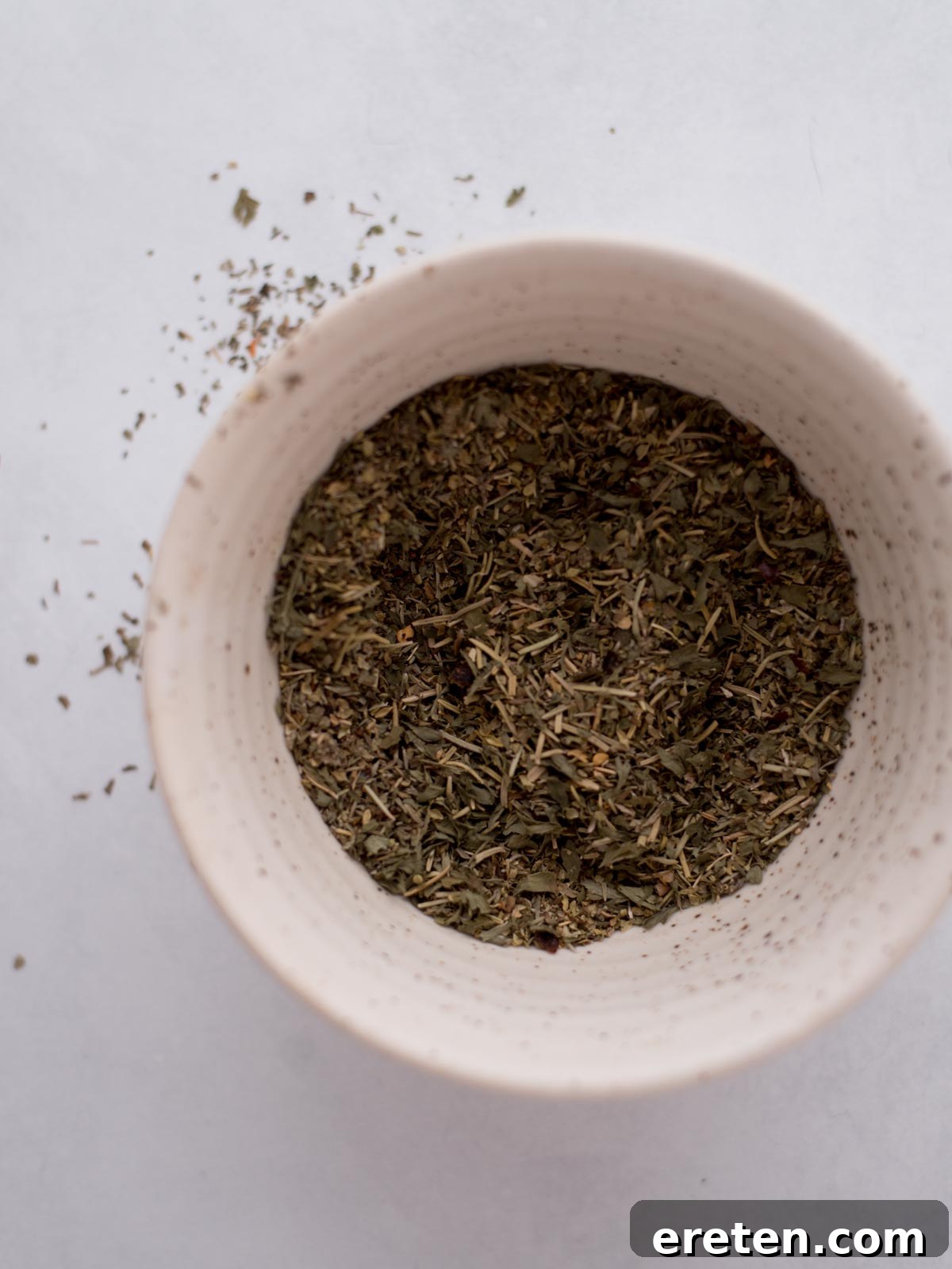 Homemade italian seasoning combined in a bowl.
