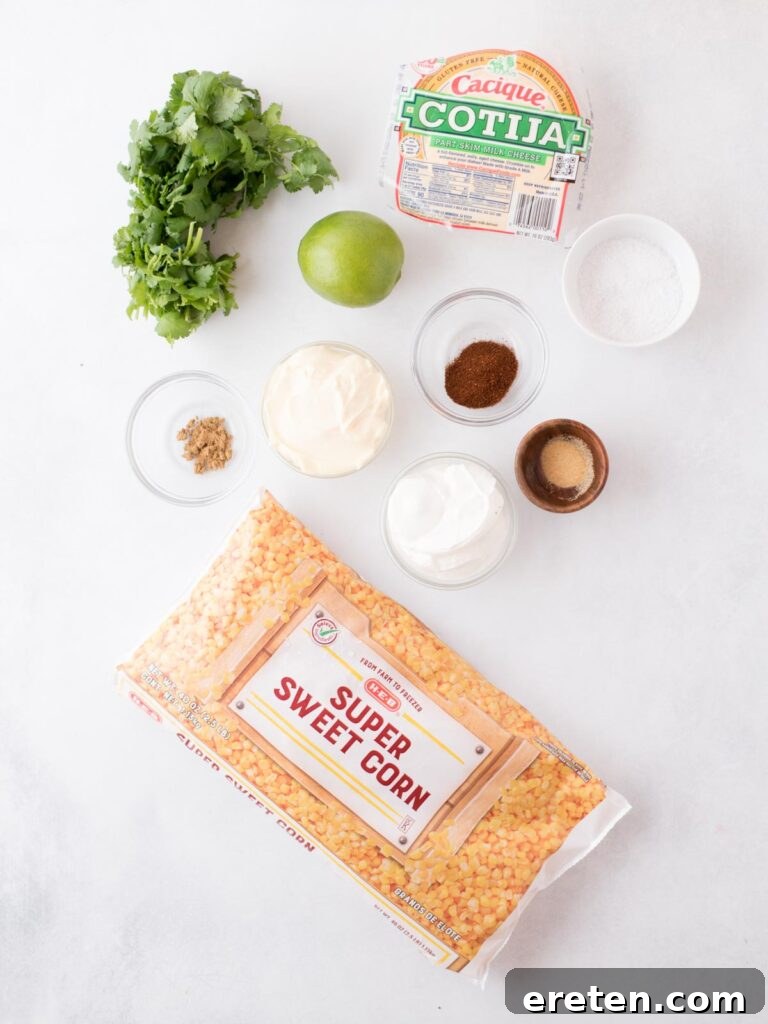 Fiesta Corn Bake 3 Various ingredients for Mexican corn casserole laid out on a wooden surface, including corn, cheese, cilantro, and spices.