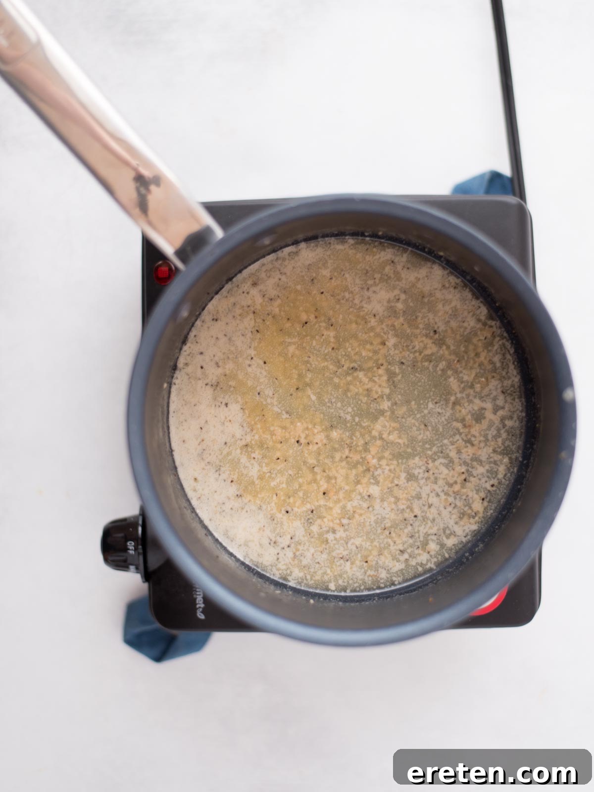 Air-Fried Golden Garlic Parmesan Wings 9 Melted butter with sautéing garlic, black pepper, and onion powder in a saucepan, infusing flavors