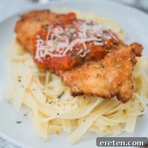 chicken parmesan on top of pasta