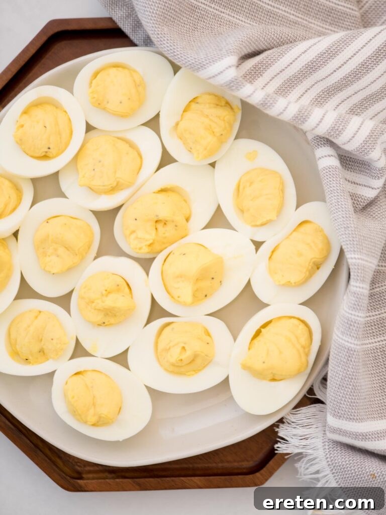 Deviled eggs on a platter without paprika.