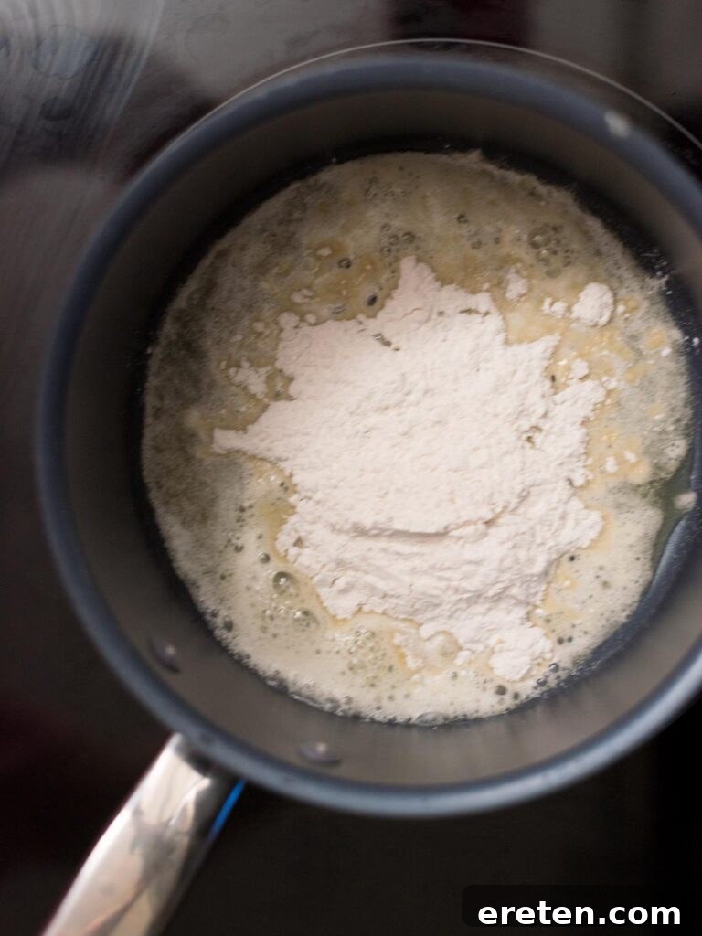 Flour added to melted butter in a saucepan.