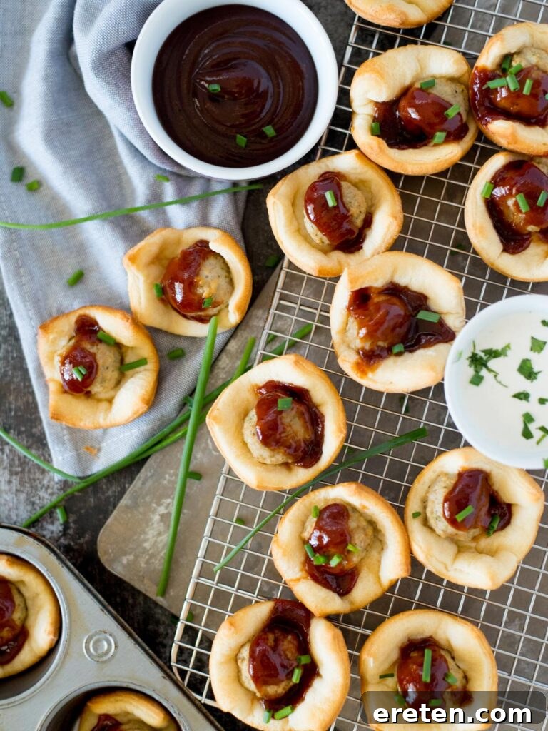 Touchdown BBQ Meatball Crescents 2 Savory game day BBQ bites topped with fresh chives, ready for a party.