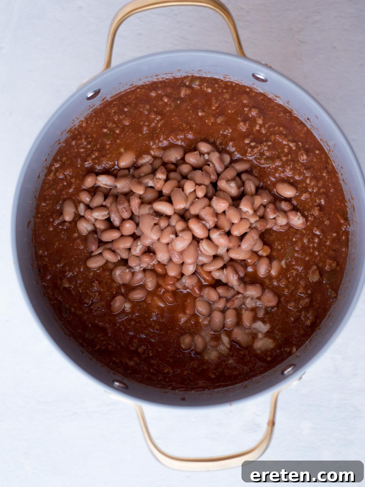 chili in a dutch oven with beans on top