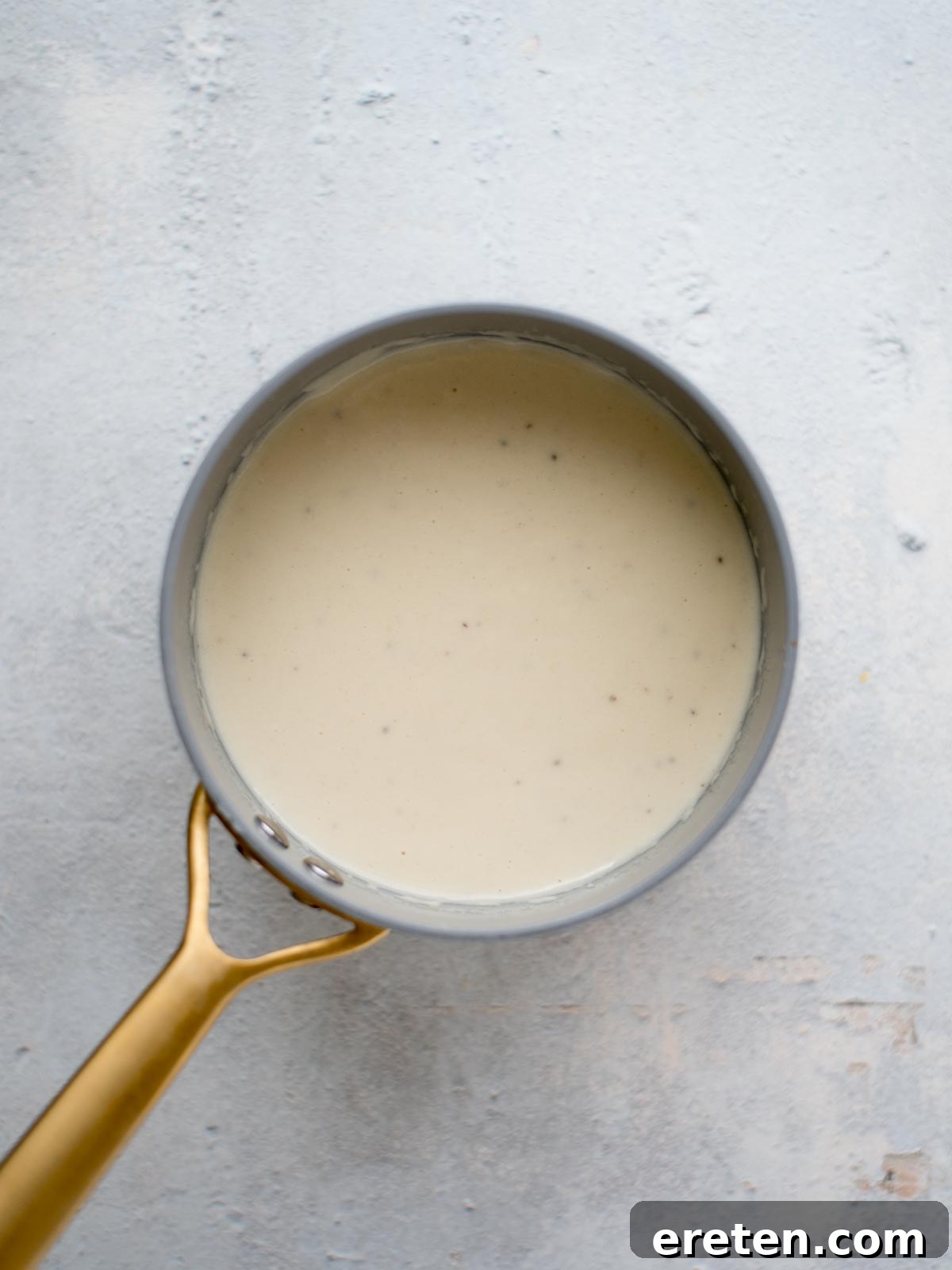 creamy Dijon Parmesan sauce in a saucepan