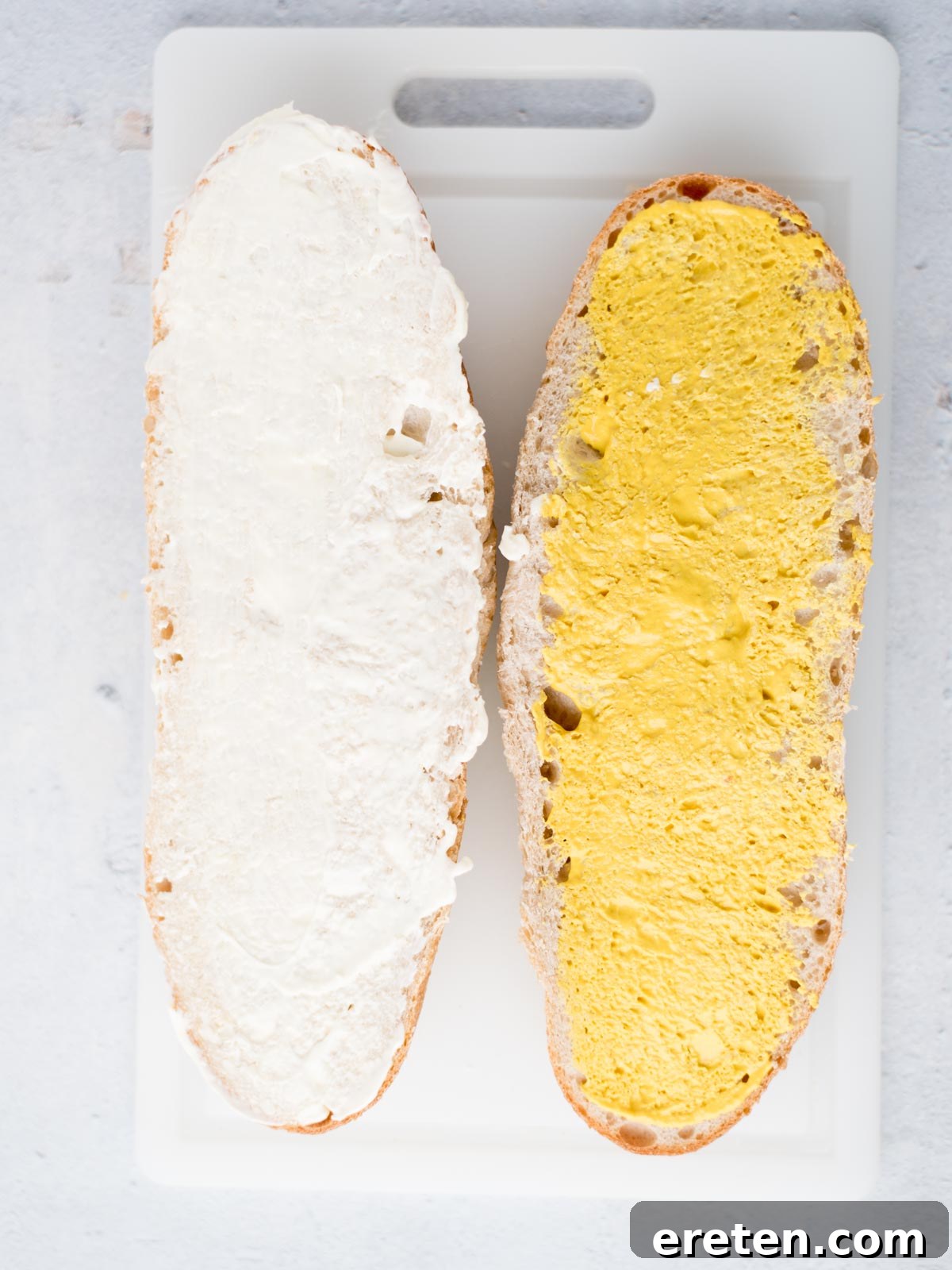 Effortless Classic Cuban Sandwich 4 halves of a french bread loaf, one with mayo and the other with mustard
