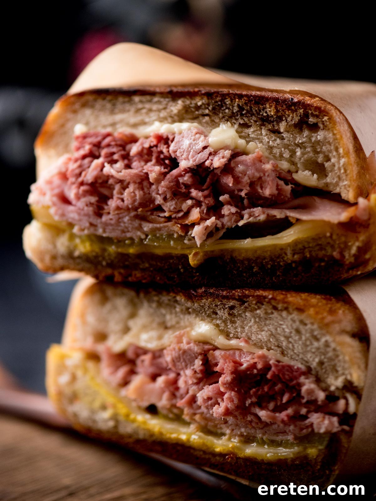Effortless Classic Cuban Sandwich 6 stacked cuban sandwiches on a bread board ready to be served
