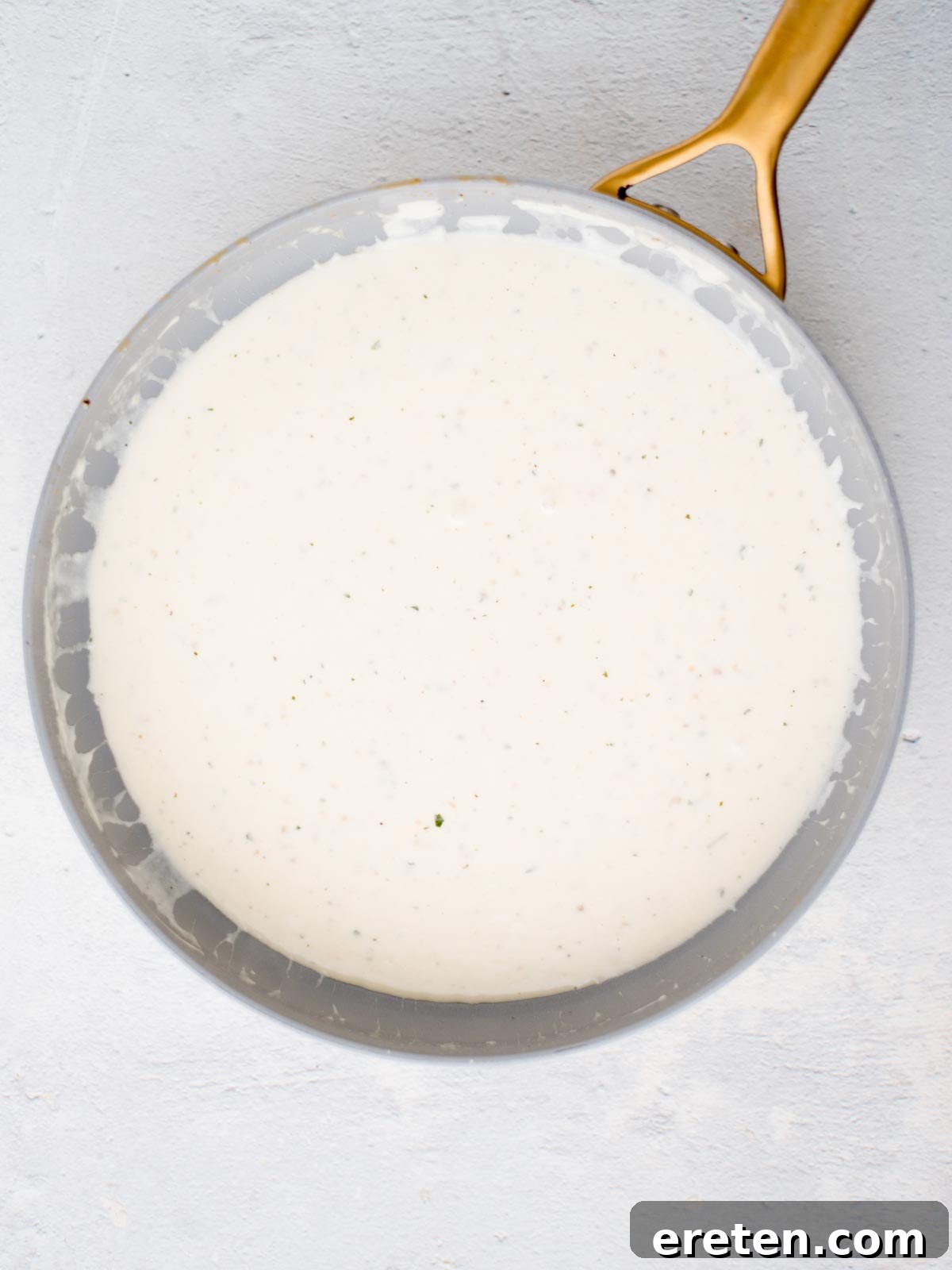 White sauce in a skillet.