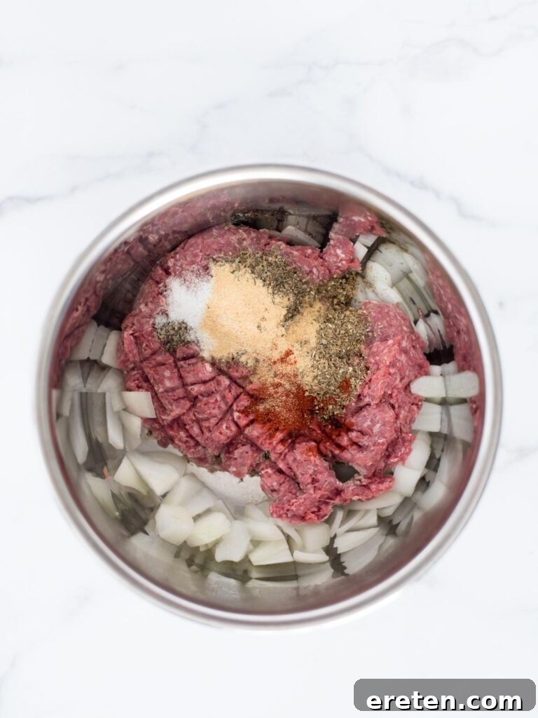 Homemade Instant Pot Cheeseburger Mac 4 ground beef, onion, and spices in instant pot