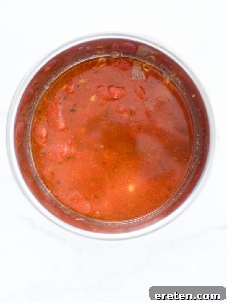 Homemade Instant Pot Cheeseburger Mac 8 water and broth poured into the instant pot