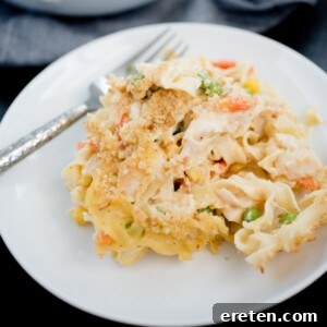 chicken noodle casserole serving on a white plate