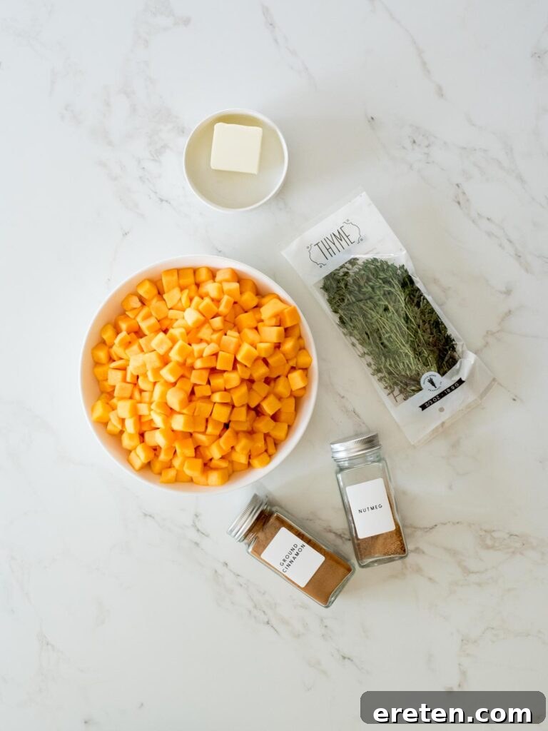 Pan-Seared Butternut Squash Delight 3 A collection of fresh ingredients laid out, including a whole butternut squash, butter, cinnamon, nutmeg, salt, and fresh thyme sprigs, ready for sautéing.