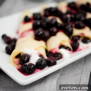 traditional crepes filled with blueberries and whipped cream