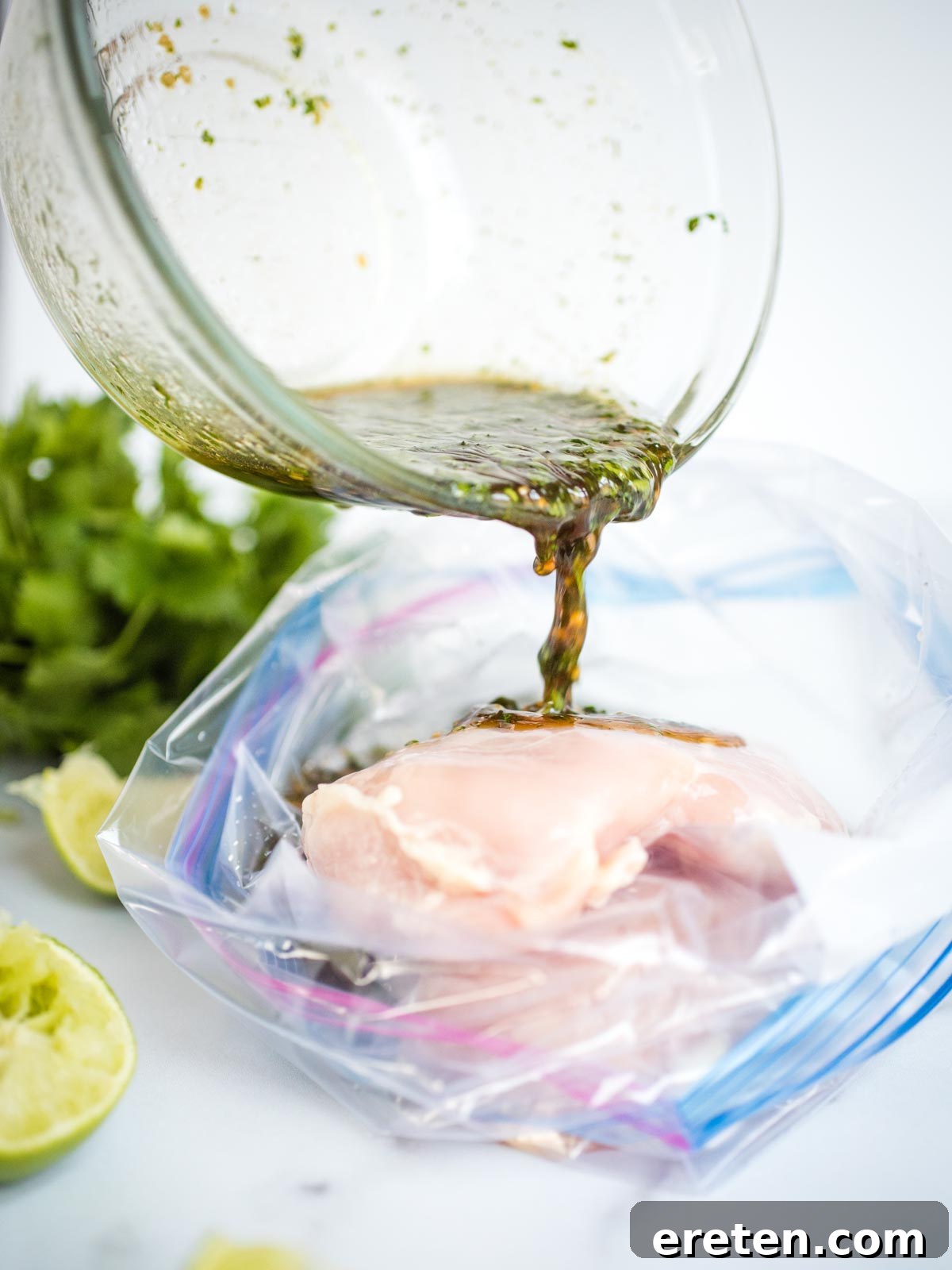 Pouring the honey lime marinade over raw chicken breasts in a food storage bag.