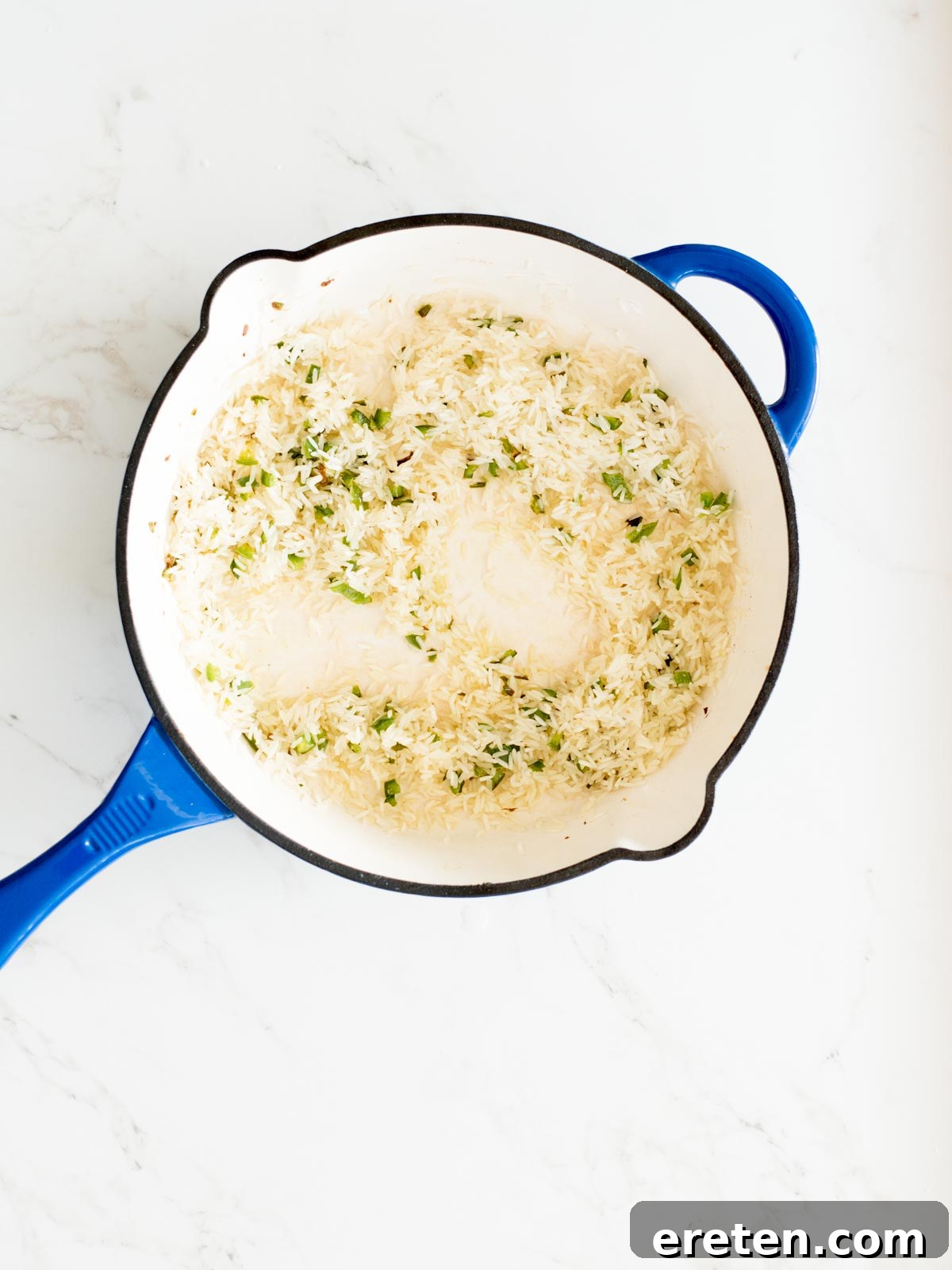 toasted rice in a cast iron skillet