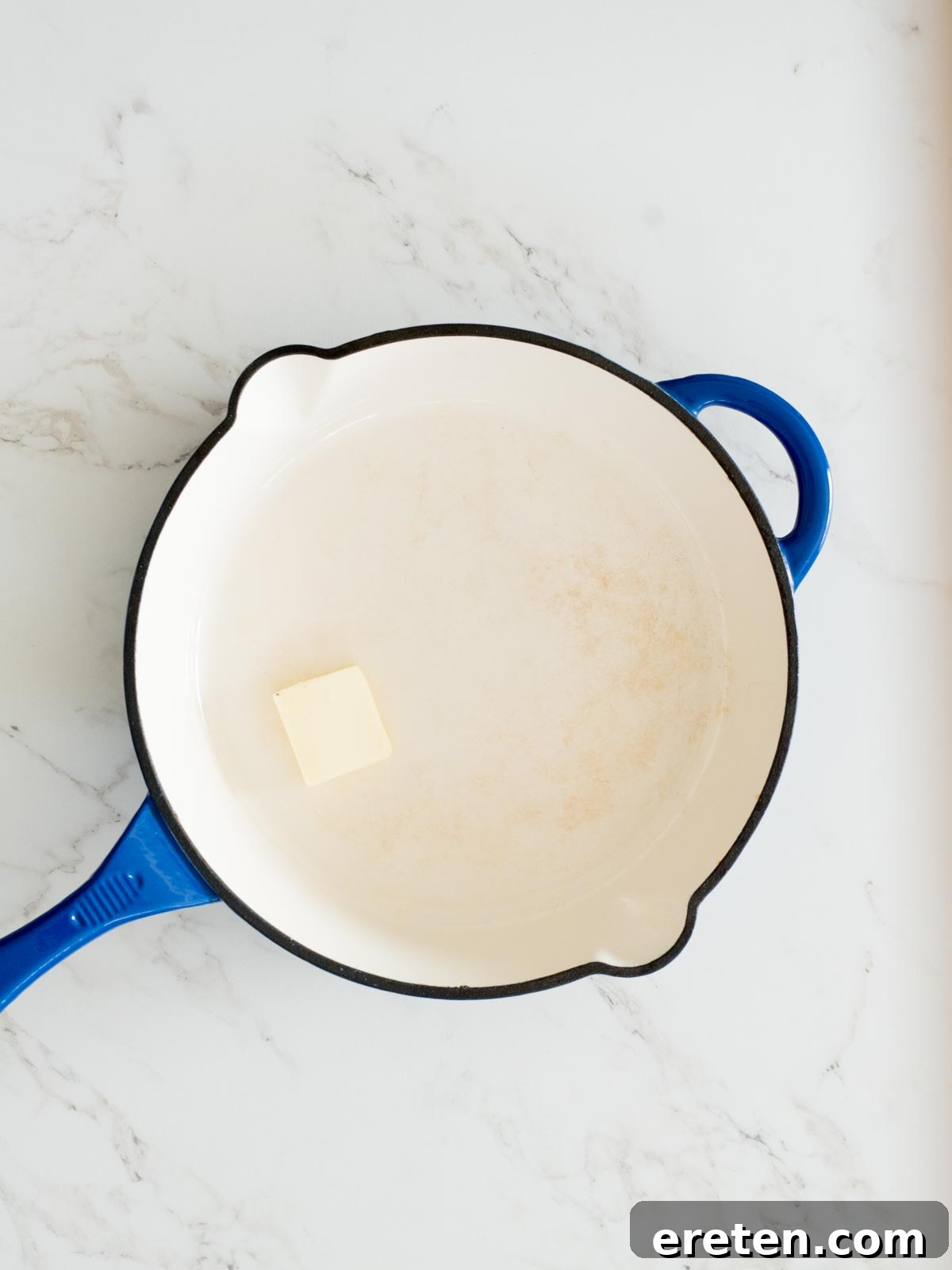 butter added to an enamel cast iron skillet