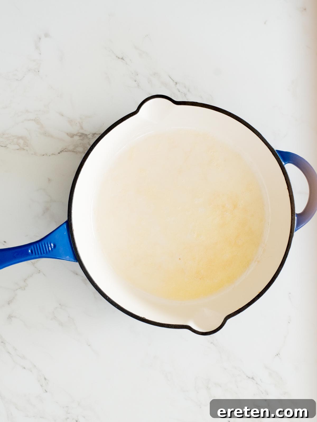 melted butter in an enamel cast iron skillet