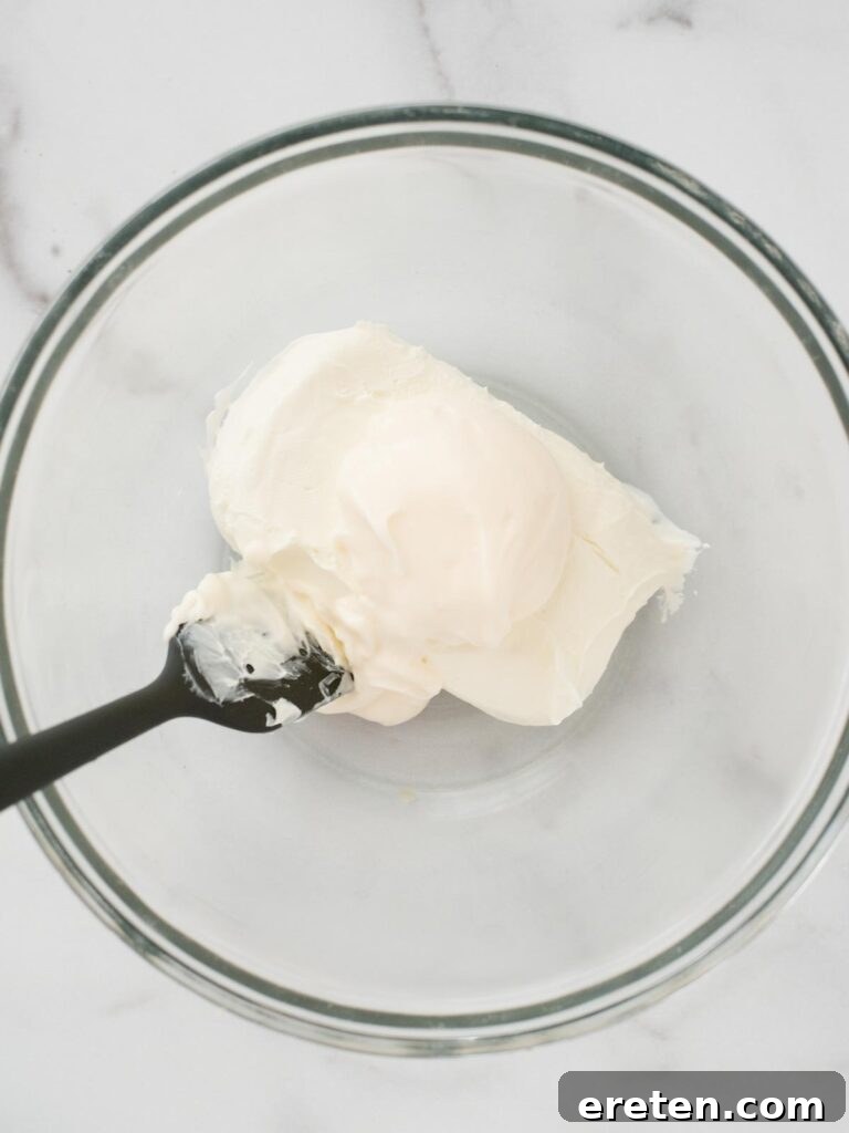 Spicy Artichoke Jalapeno Fusion 4 Softened cream cheese in a mixing bowl, ready for combining.