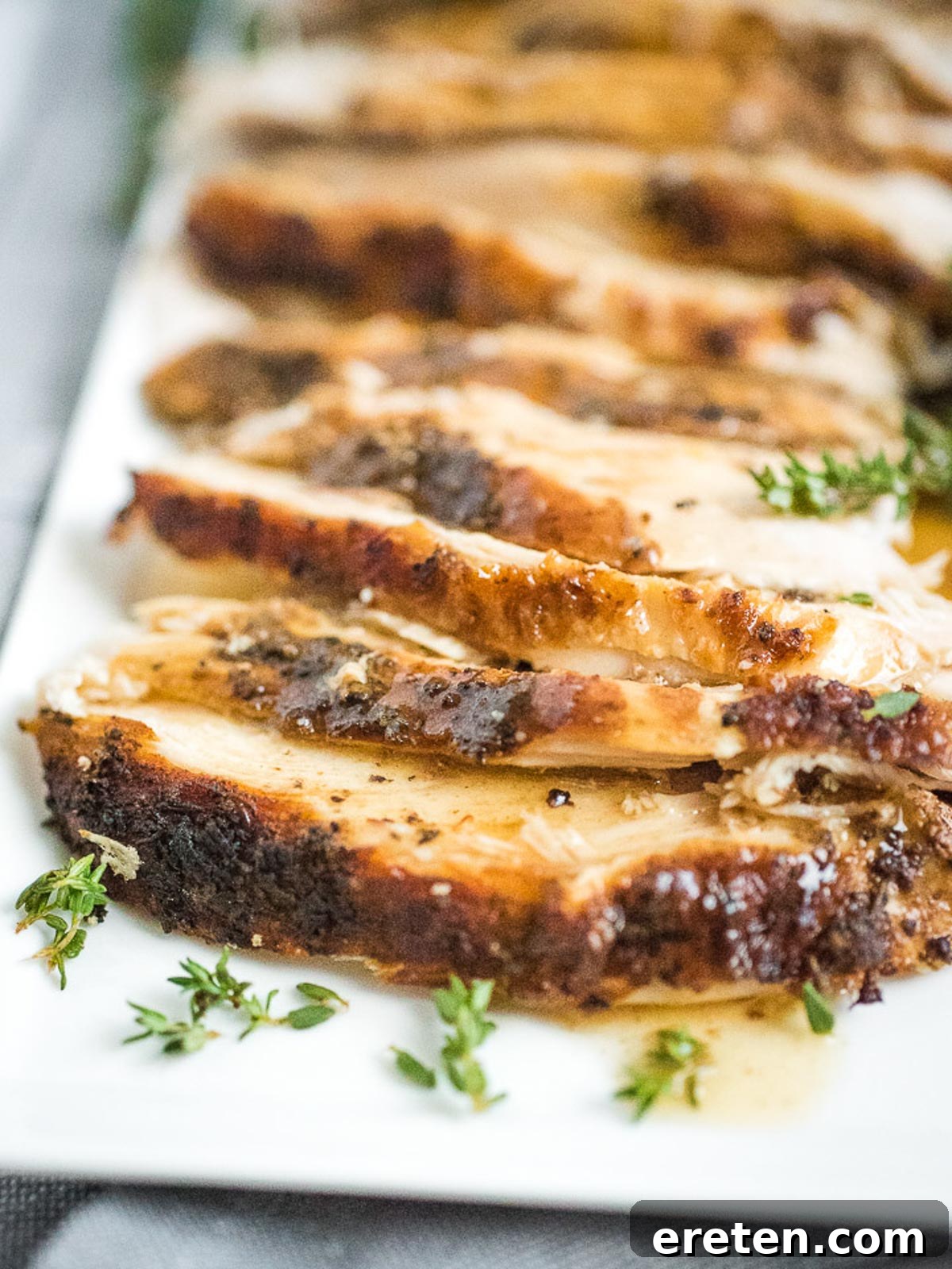 Perfectly Tender Instant Pot Bone-In Turkey Breast 2 sliced turkey breast on plate with gravy