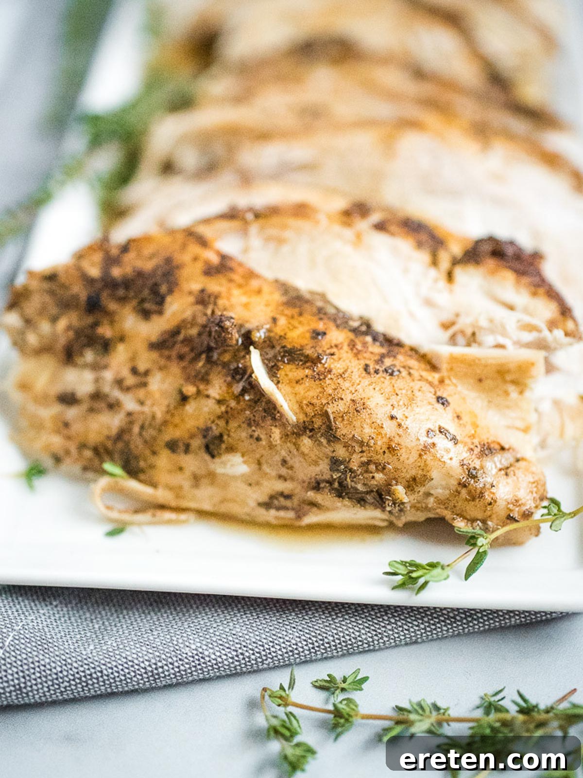 Perfectly Tender Instant Pot Bone-In Turkey Breast 3 sliced turkey breast on plate with gravy