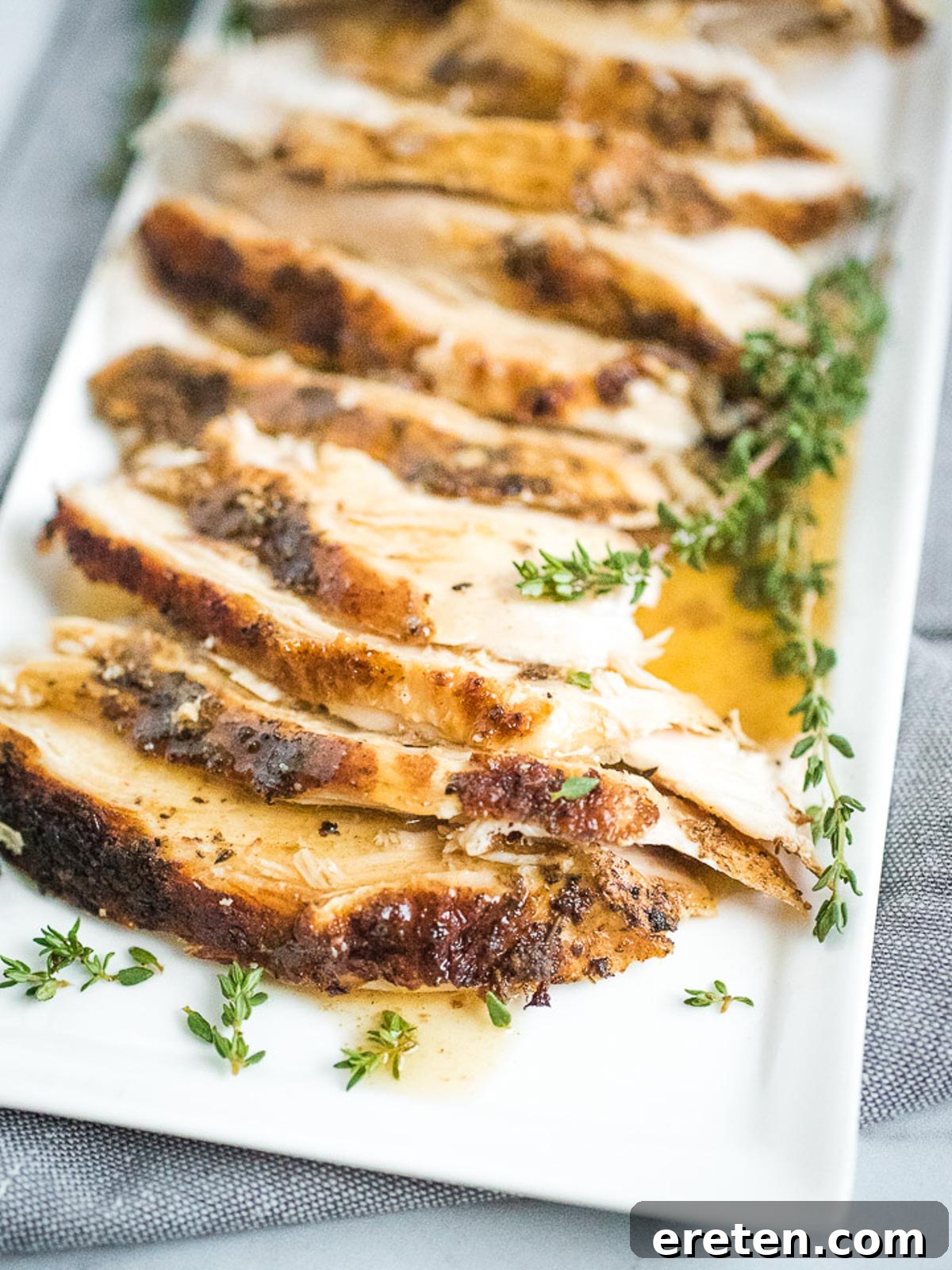 Perfectly Tender Instant Pot Bone-In Turkey Breast 6 sliced turkey breast on plate with gravy