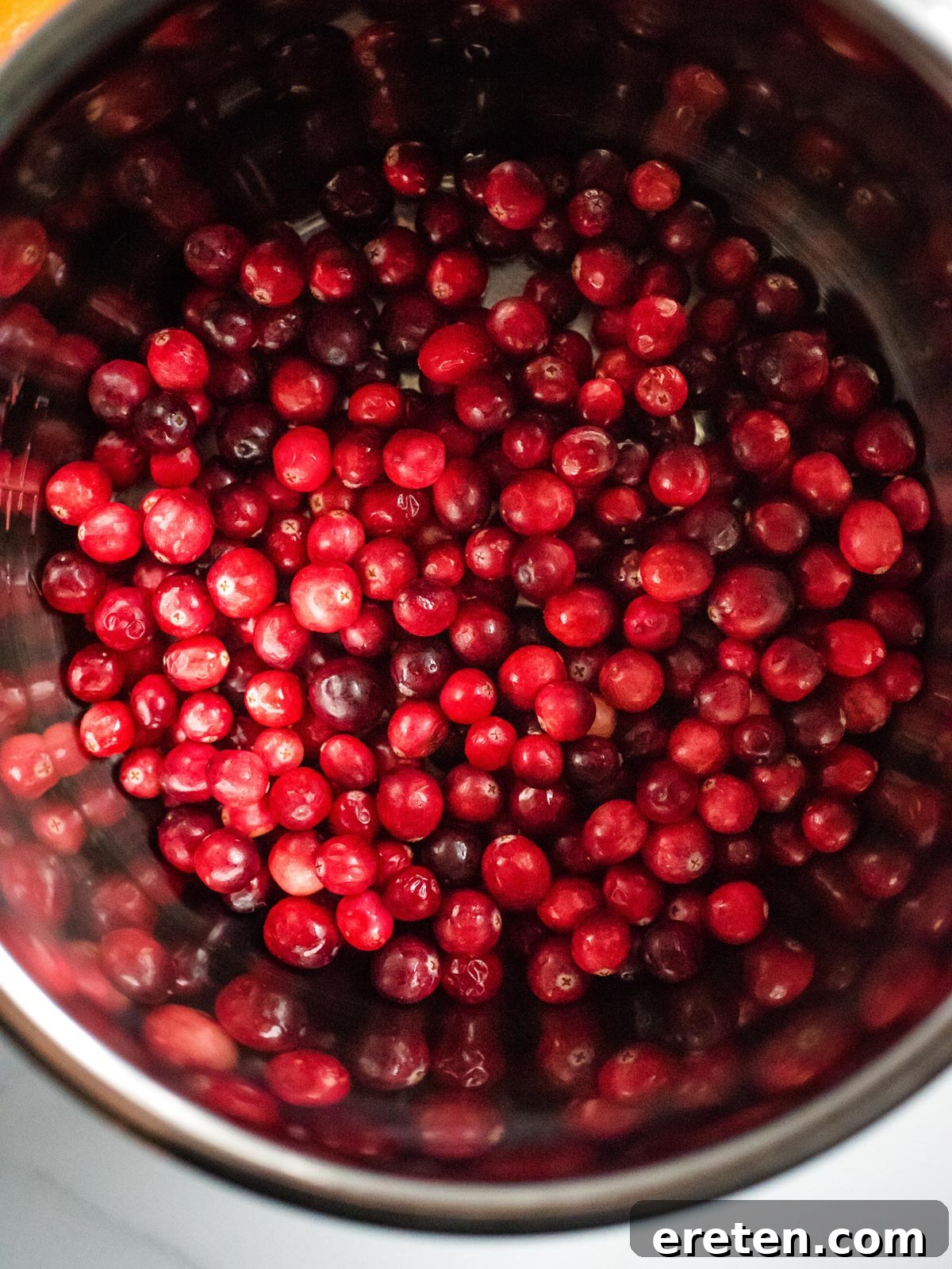 Vibrant Instant Pot Cranberry Orange Sauce 4 instant pot sleeve filled with cranberries