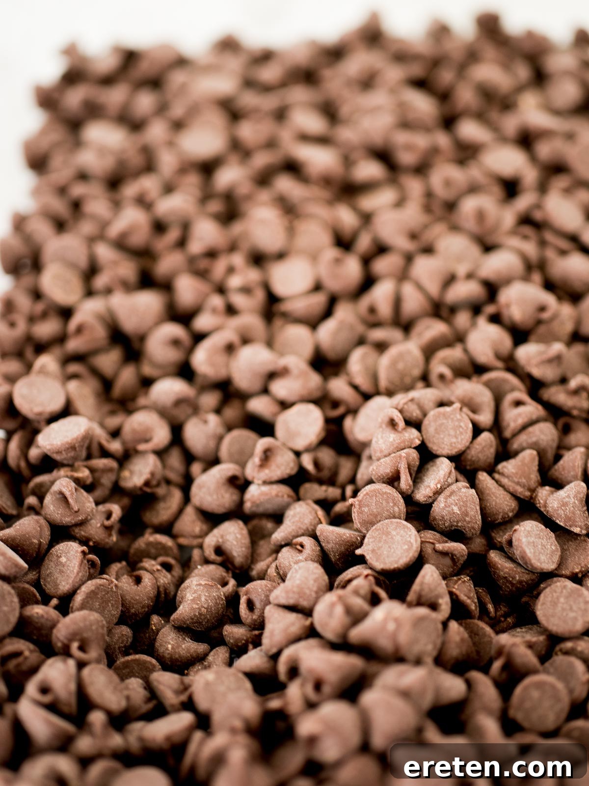 A generous pile of luscious chocolate chips, gleaming and ready to be folded into rich cookie dough