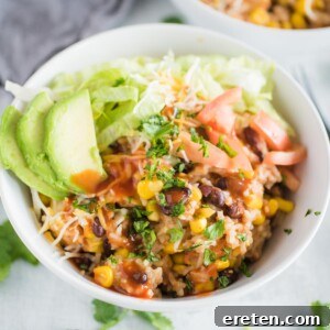 a bowl of instant pot chicken burrito bowl with toppings