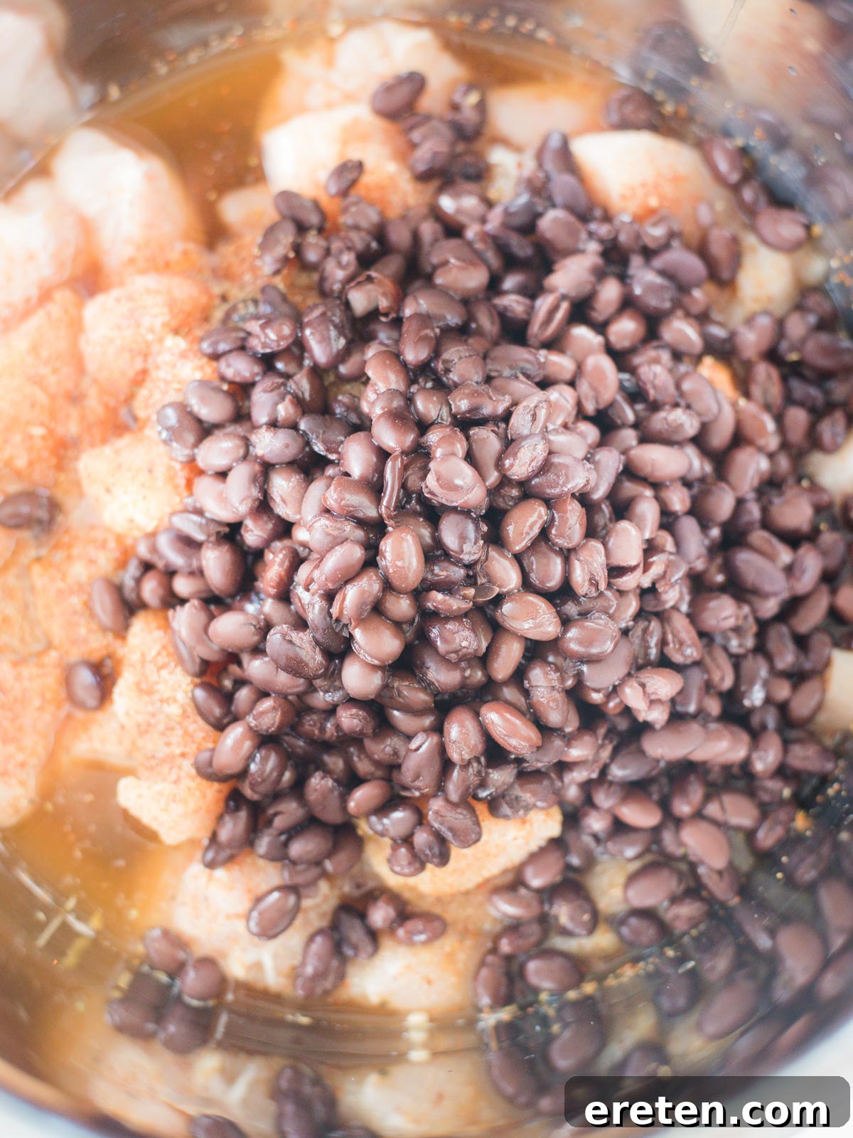 ingredients in instant pot insert with beans