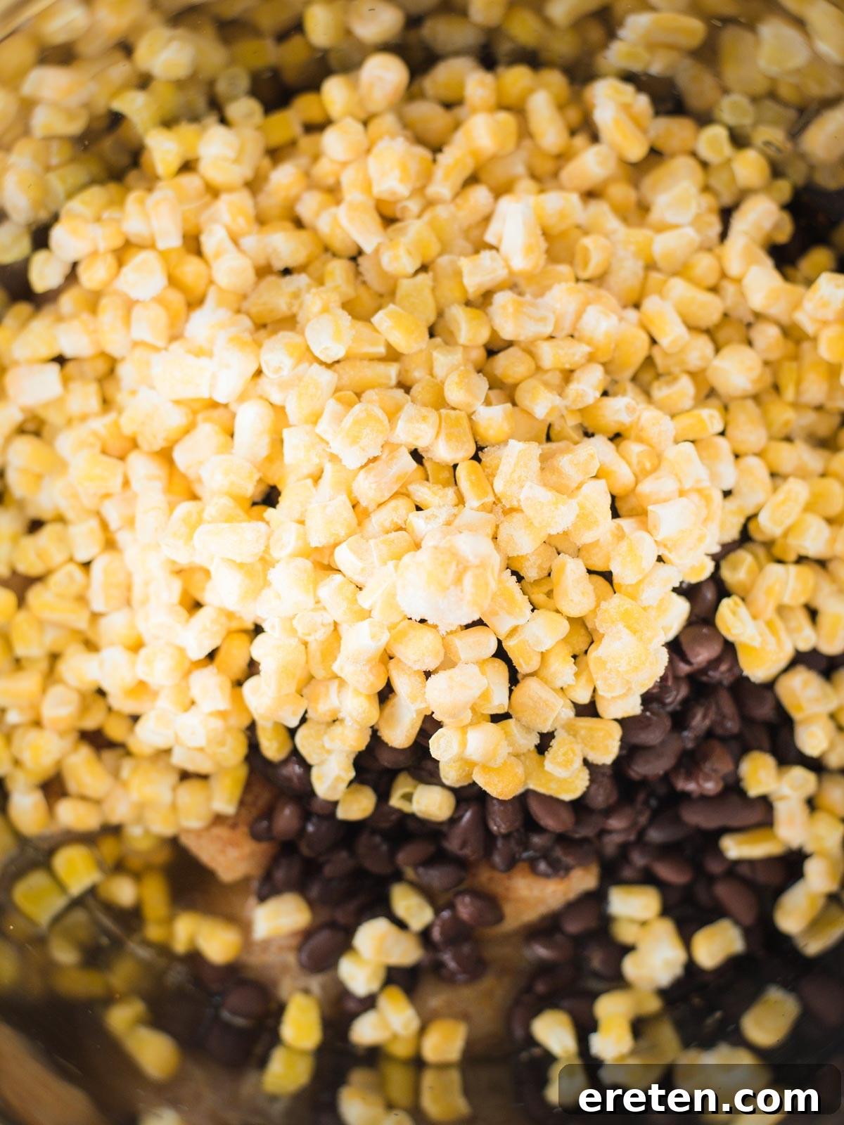 ingredients in instant pot with corn on top