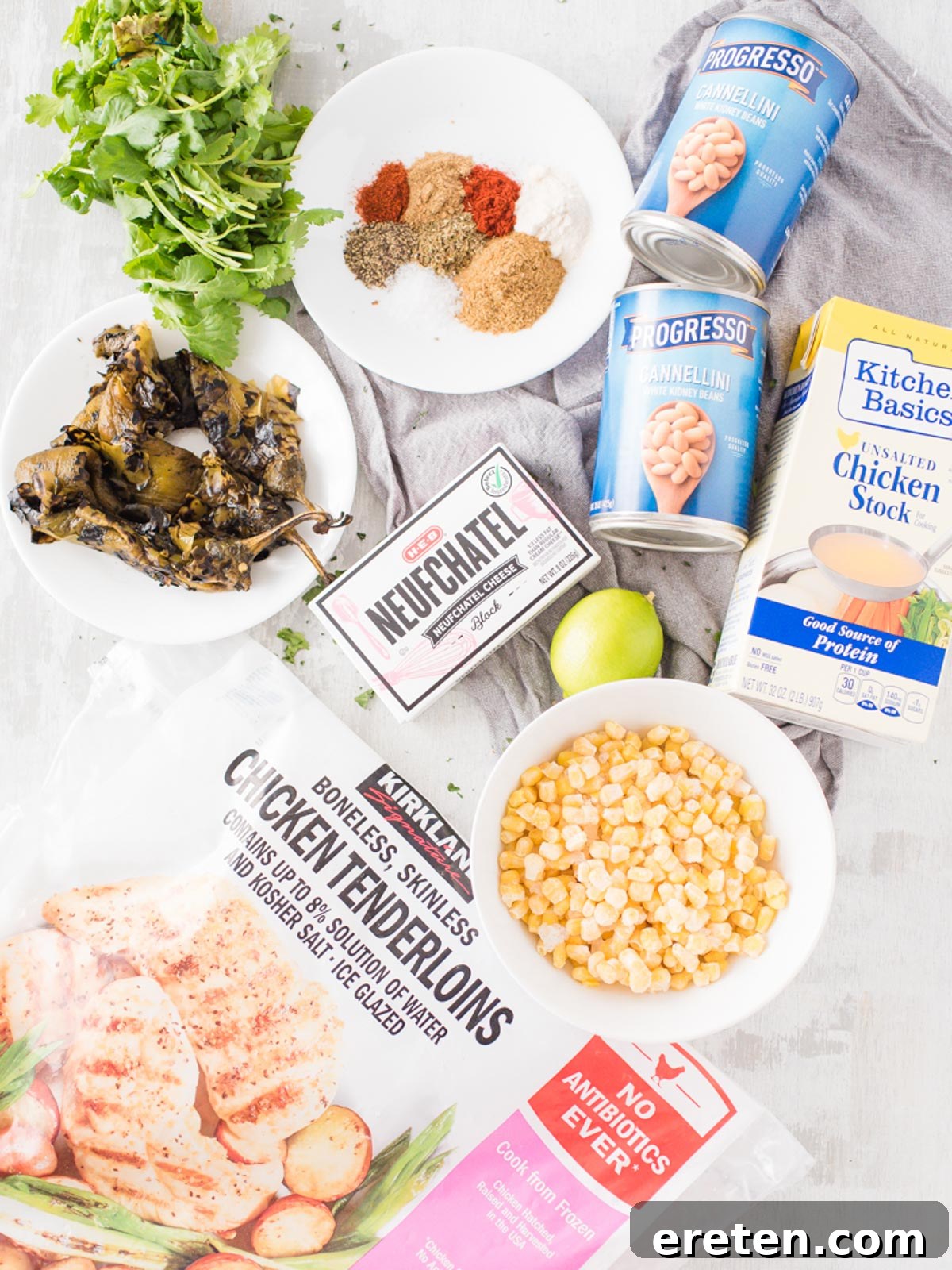 An array of fresh and pantry ingredients meticulously arranged on a kitchen counter, showcasing the components needed for Instant Pot White Chicken Chili.