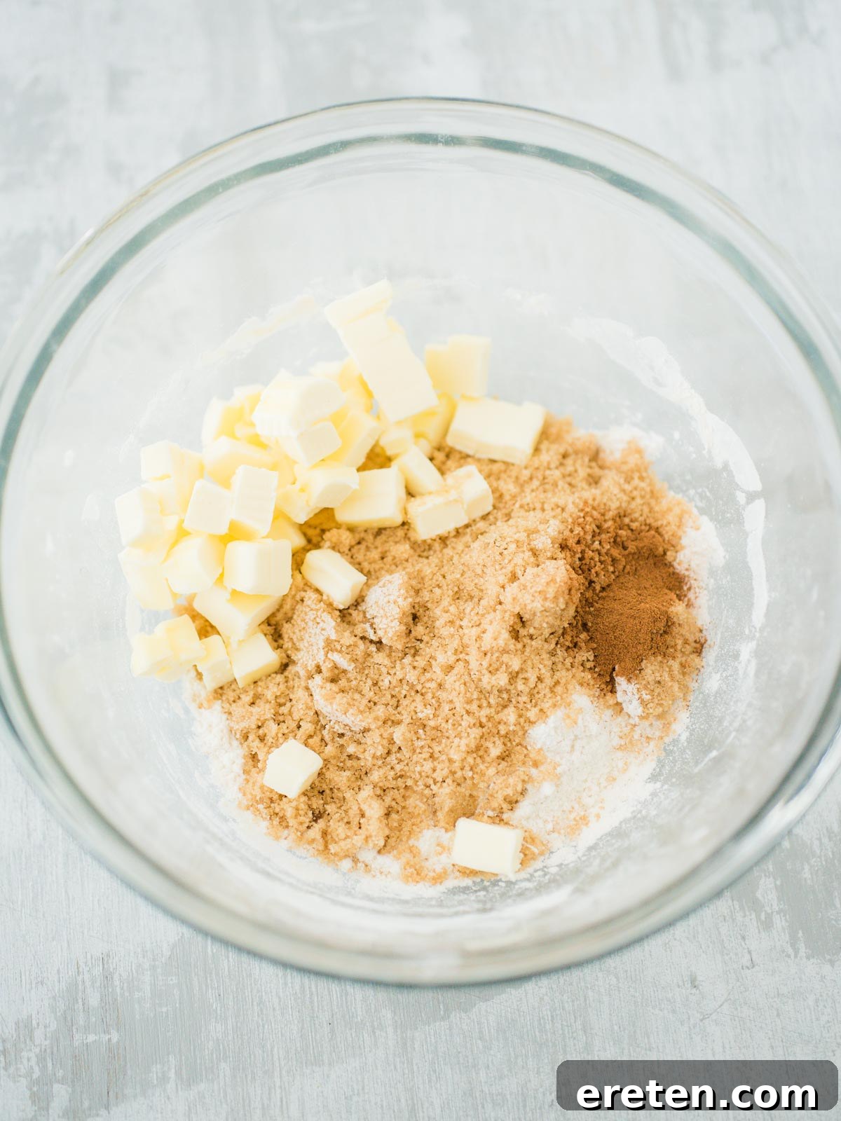 Sweet Pizza Creations: A Homemade Guide 5 Ingredients for the streusel topping, including flour, brown sugar, and butter pieces, in a mixing bowl.