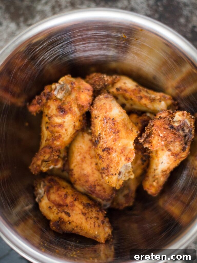 Crispy Air Fryer Dry Rub Wings 8 air fried chicken wings in a bowl