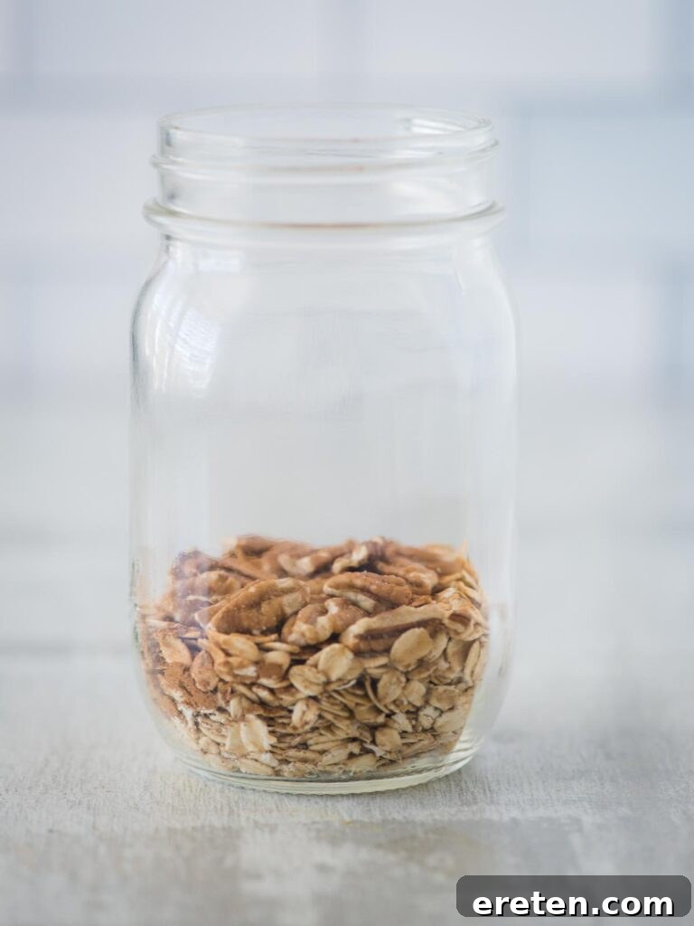 Creamy Banana Nut Bread Overnight Oats 6 Chopped pecans sprinkled into the jar, adding a delightful crunch and nutty flavor to the banana bread overnight oats mixture.