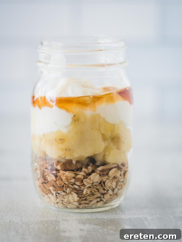 Creamy Banana Nut Bread Overnight Oats 9 A stream of pure maple syrup drizzled into the jar, enhancing the sweetness and moistness of the banana bread overnight oats.