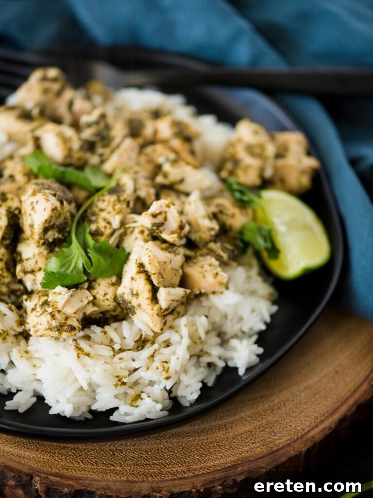 close-up shot of slow cooker cilantro lime chicken on a plate with garnishes