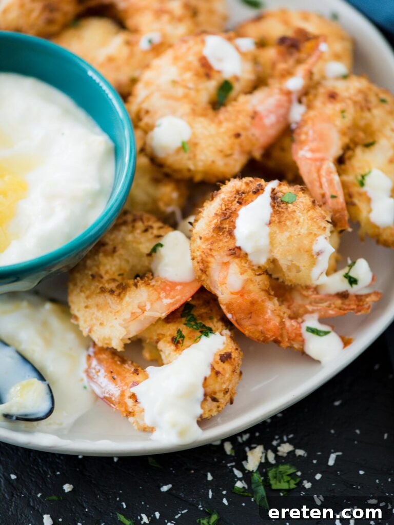 Plated Air Fryer Coconut Shrimp with Creamy Pineapple Dipping Sauce