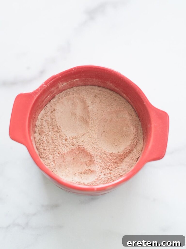 wells made in dry ingredients in mug