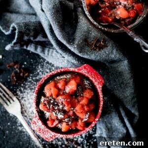Chocolate Mug Cake with Sweet Strawberry Topping and powdered sugar