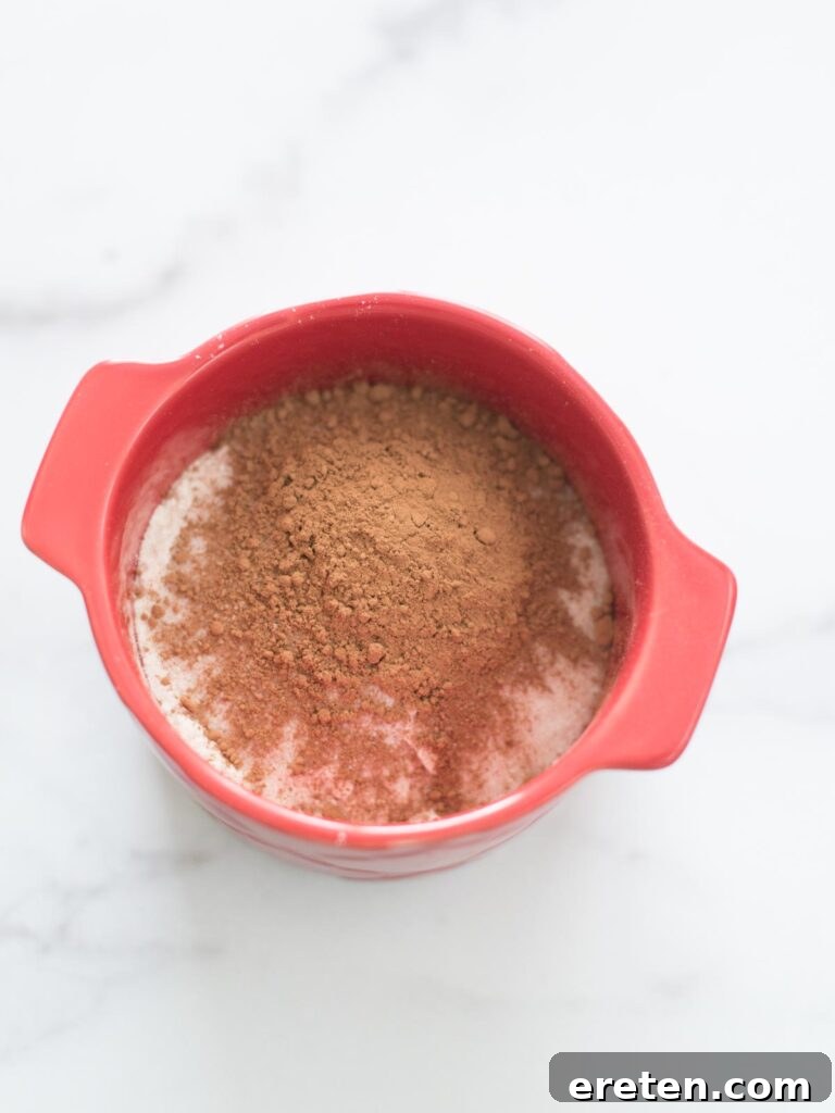 cocoa powder added to mug