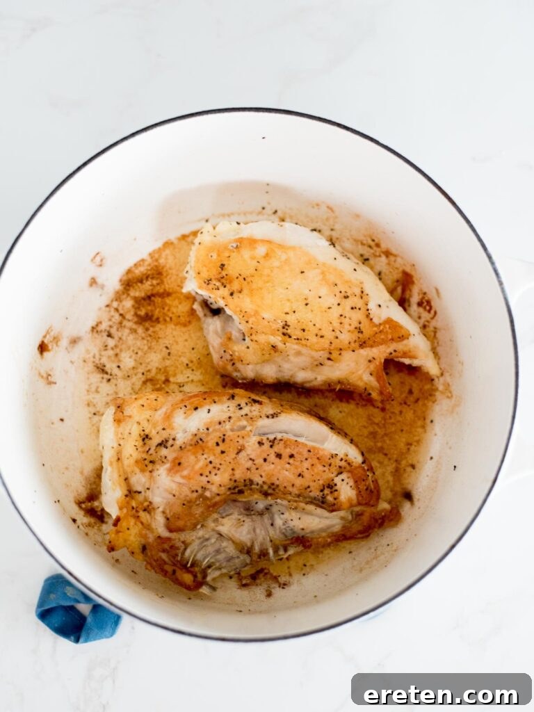 Rustic Oven Baked Chicken Cacciatore 4 seared chicken inside of a dutch oven