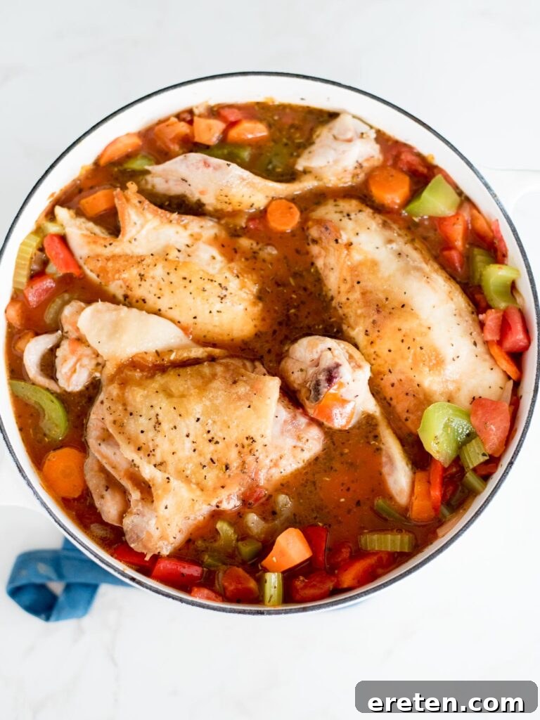 Rustic Oven Baked Chicken Cacciatore 8 chicken added back into the dutch oven with the vegetables