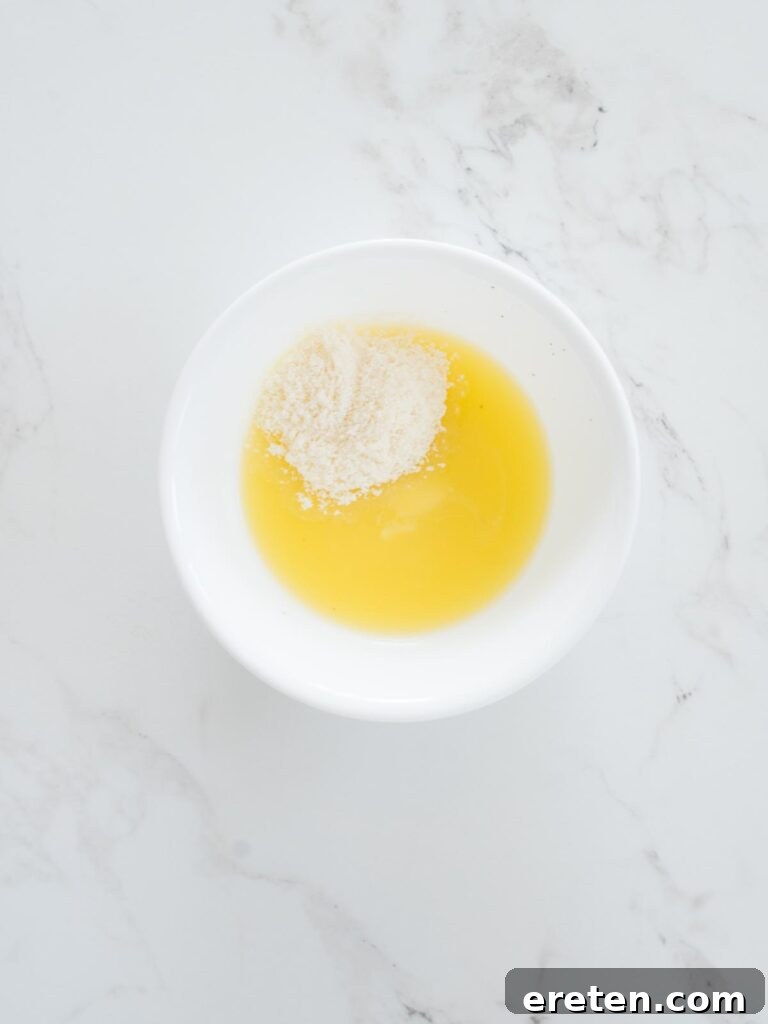 shredded parmesan cheese added to melted butter