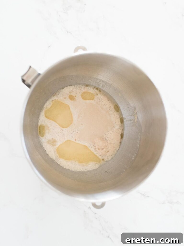 oil and salt added to foamy proofed yeast mixture