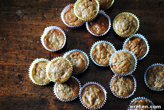 Ultimate Banana Bread Muffins 4 Freshly baked Banana Bread Muffins cooling on a rack