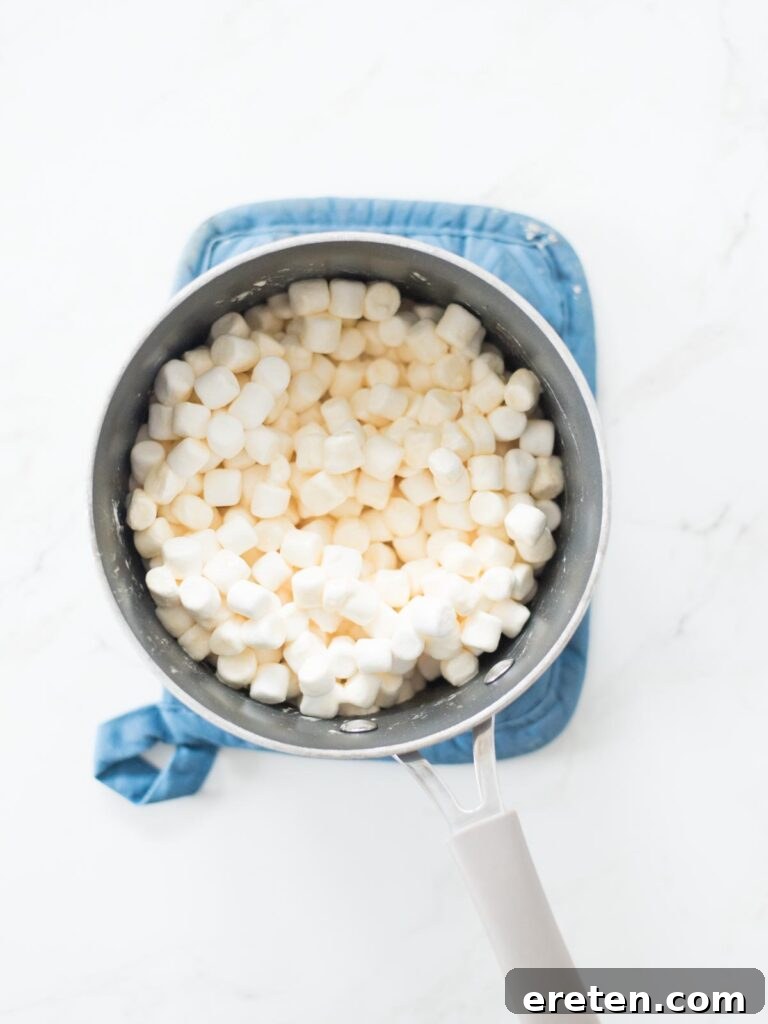 marshmallows added to a saucepan